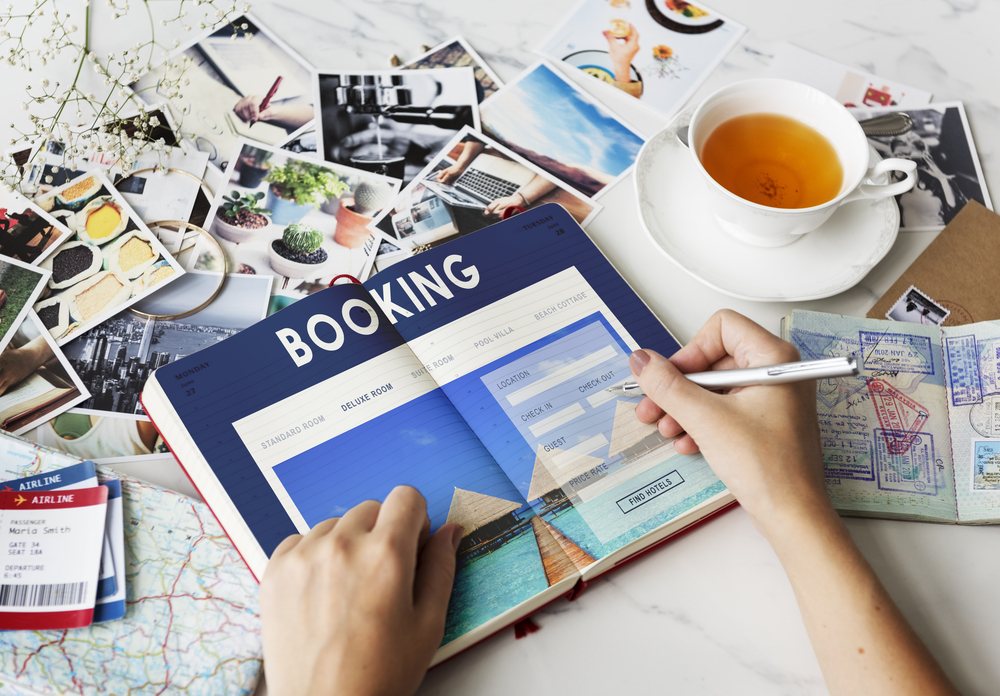 Woman Booking Using Booking Book